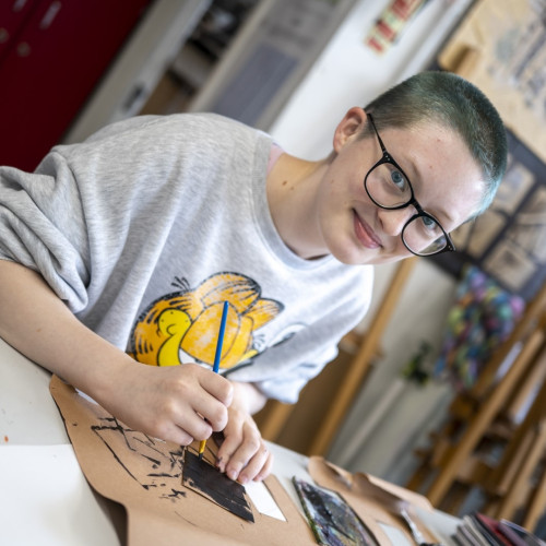 Student doing art